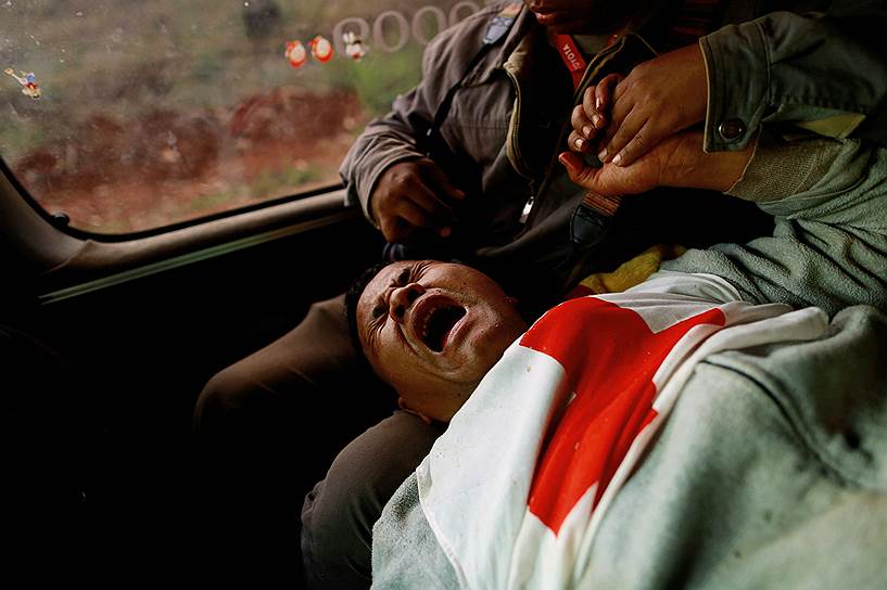 Лауккай, Мьянма. Волонтер «Красного Креста», раненная при атаке сепаратистов на автоколонну