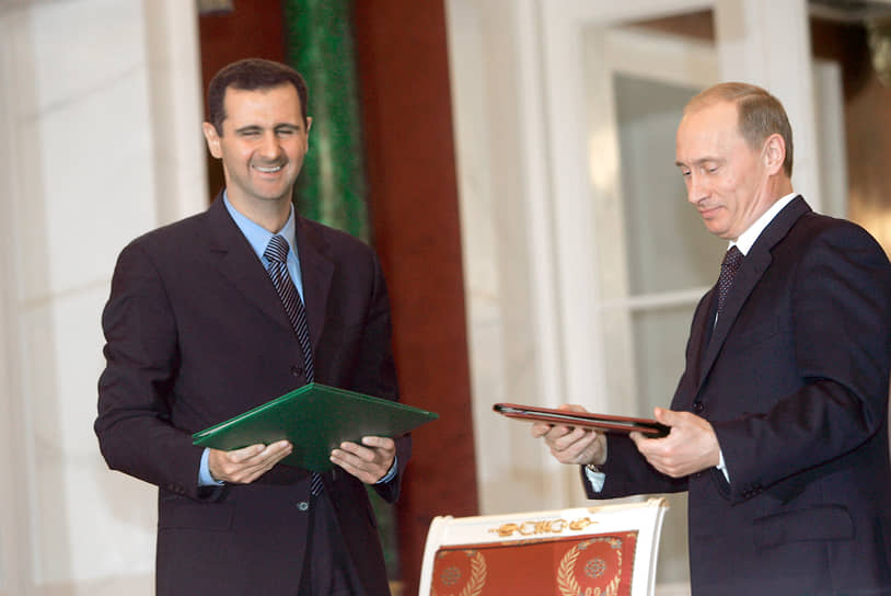 Президент России Владимир Путин (справа) и президент Сирии Башар Асад во время встречи в Георгиевском зале Большого Кремлевского дворца, 2005 год