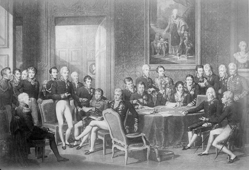 Международный конгресс в Вене открылся в ноябре 1814 года. Он был призван определить дальнейшую судьбу Европы, бесконечно уставшей от двух с половиной десятилетий всеобщей войны, начатой в связи с революцией во Франции и продолженной Наполеоном. В истории международных отношений Венский конгресс незаслуженно обойден вниманием: сформированная на нем система находится в тени Вестфальского мира, увенчавшего в 1648 году Тридцатилетнюю войну (1618–1648), и Версальско-Вашингтонской системы, обозначившей в 1918-м оказавшийся очень хрупким мир по итогам Первой мировой. Венский конгресс, где главные роли играли Россия, Британия, Пруссия и Австрия, длился более полугода и по атмосфере напоминал серию великосветских раутов. Тем не менее участникам удалось сформулировать параметры долгого мира, продлившегося как минимум четыре десятилетия — до Крымской войны, в которой Россия оказалась противником франко-британского альянса (1853–1856). По сути же, некоторые основы Венской системы сохранялись вплоть до начала Первой мировой — то есть в общей сложности почти столетие