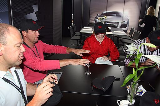 Формула А. Тренинг "Audi Driving Experience" на трасе Зальцбургринг на автомобилях Audi R8 и Audi TTS. Президент компании "Евросеть" Алексей Чуйкин (слева) и генеральный директор холдинга "Объединенные кондитеры" Артем Кузнецов (второй слева) на тренинге