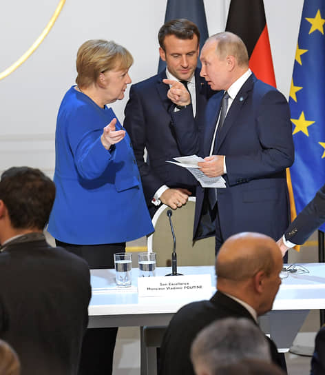 Канцлер Германии Ангела Меркель, президент Франции Эмманюэль Макрон и президент России Владимир Путин