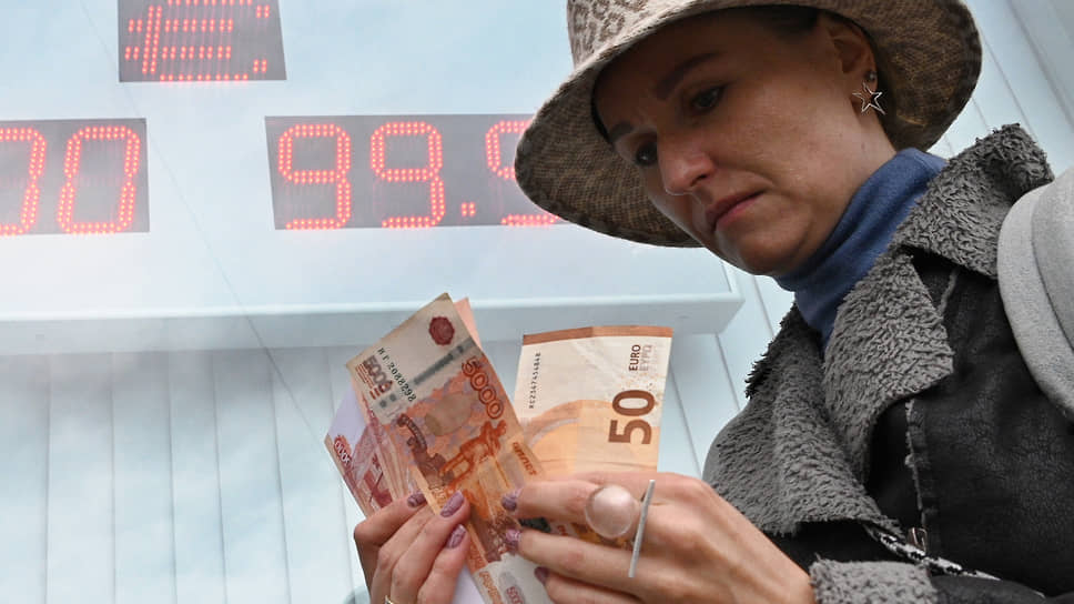 Why are banks tightening the rules for accepting dollars and euros in cash?