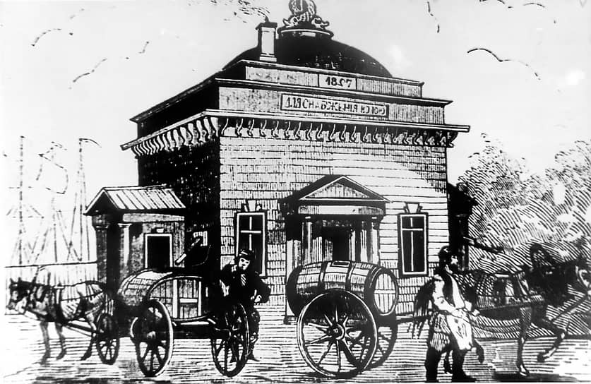 1857 г. Российская империя, Санкт-Петербург.
Гравюра неизвестного автора. Водовозы возле здания водокачки с надписью: «Для снабжения водою»