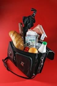 Портфель набитый продуктами и газетами