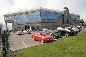 территория выставочного комплекса 'ЛенЭкспо' и застройка Васильевского острова.Строительство порта 'Морской фасад' на намывной территории