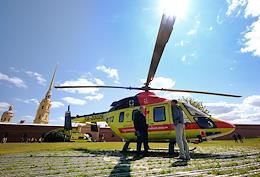 Transferring a patient from a medical helicopter to an ambulance team at the helipad of the Peter and Paul Fortress