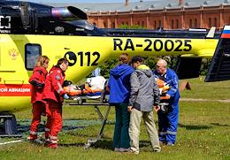 Transferring a patient from a medical helicopter to an ambulance team at the helipad of the Peter and Paul Fortress