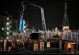 Construction site of a residential building. Night pouring of concrete