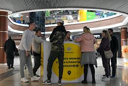 Work of Tinkoff Bank in Crimea. Bank representatives issue and issue debit and credit cards to residents of Crimea in a shopping center