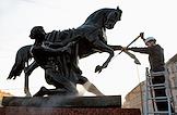 Employees of the Museum of Urban Sculpture are carrying out a spring cleaning of the sculptures 'Taming the Horse' by architect Pyotr Klodt on the Anichkov Bridge