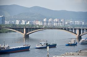 Genre photos. Festive Parade of ships in the waters of the Yenisei in honor of the Day of workers of the sea and river fleet in Krasnoyarsk