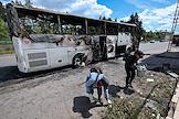Последствия атаки дрона на рейсовой автобус 'Москва- Симферополь' в районе населенного пункта Енакиево под Горловкой (ДНР)