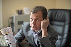 Заместитель генерального директора компании 'Финам' Сергей Опарин во время интервью в офисе бизнес-центра 'Даев-плаза'