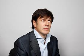 Генеральный директор холдинга 'Офис Премьер' Илья Мазин и Екатерина Комбурова в студии ИД 'Коммерсантъ'