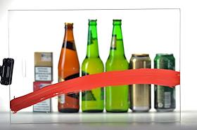 Обложка для журнала 'Деньги'. Бутылки и банки с пивом и пачки сигарет, перечеркнутые красной линией